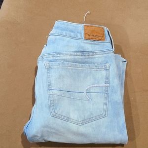 Ladies Super Super stretch x4 American Eagle light blue with worn out knees.